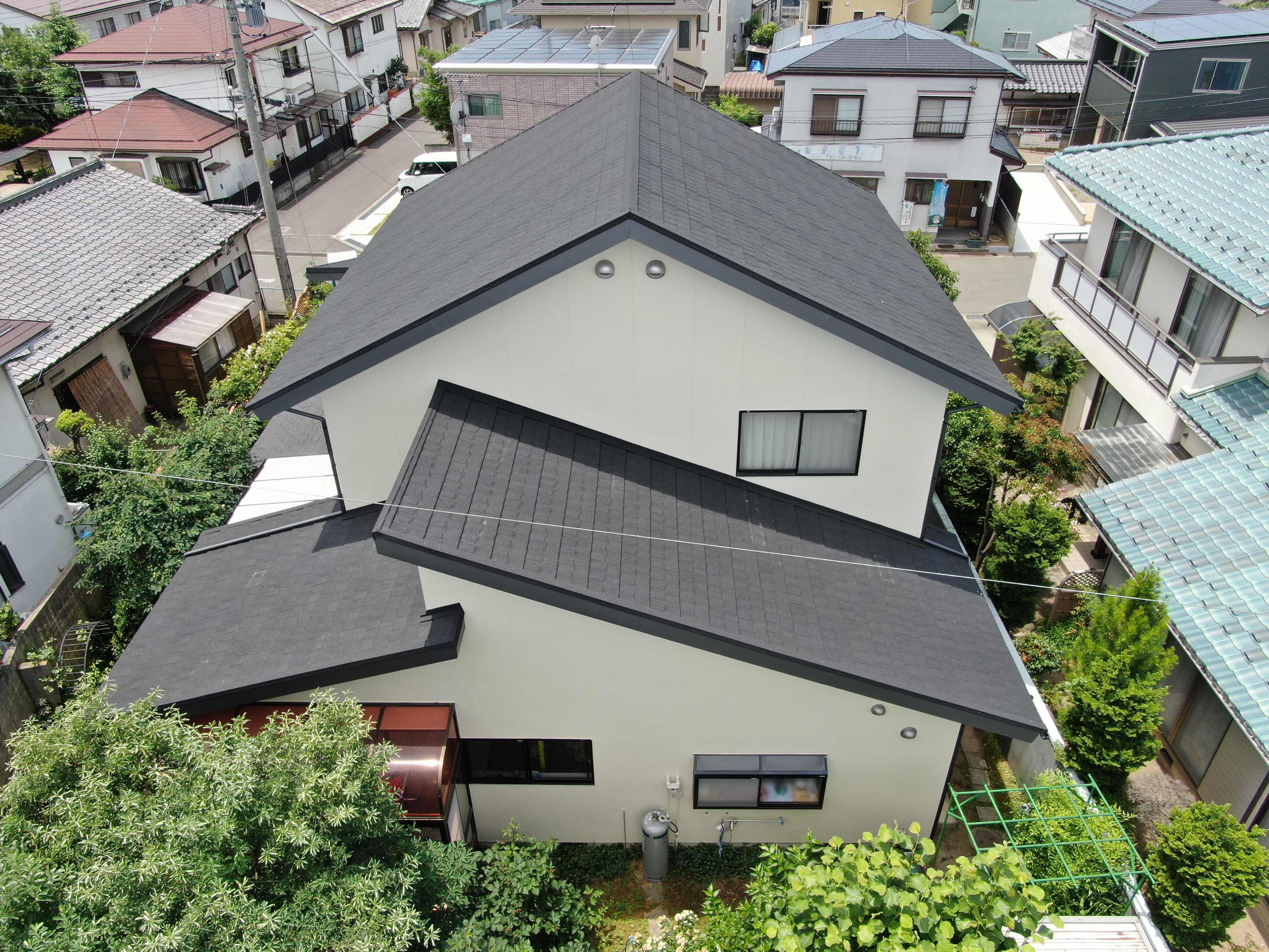 長野県長野市で外装リフォーム　屋根はLIXILのTルーフでカバー　外壁塗装　雨樋掛け替え 写真